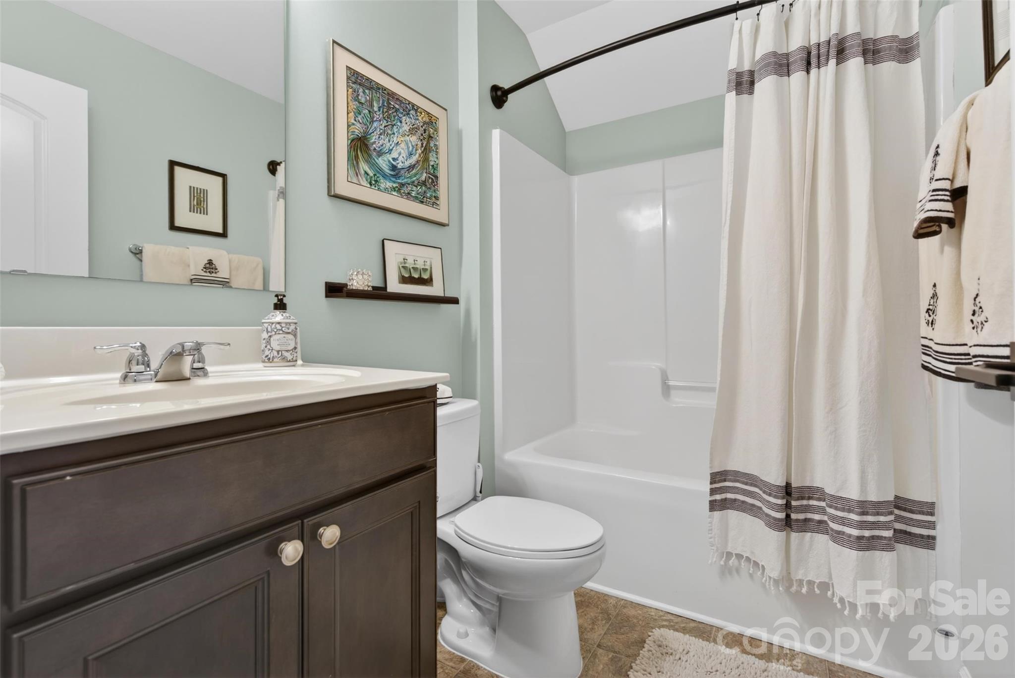 6038 Durango Way Denver, NC 28037 - Photo 13 of 20 a bathroom with a sink a toilet and a mirror