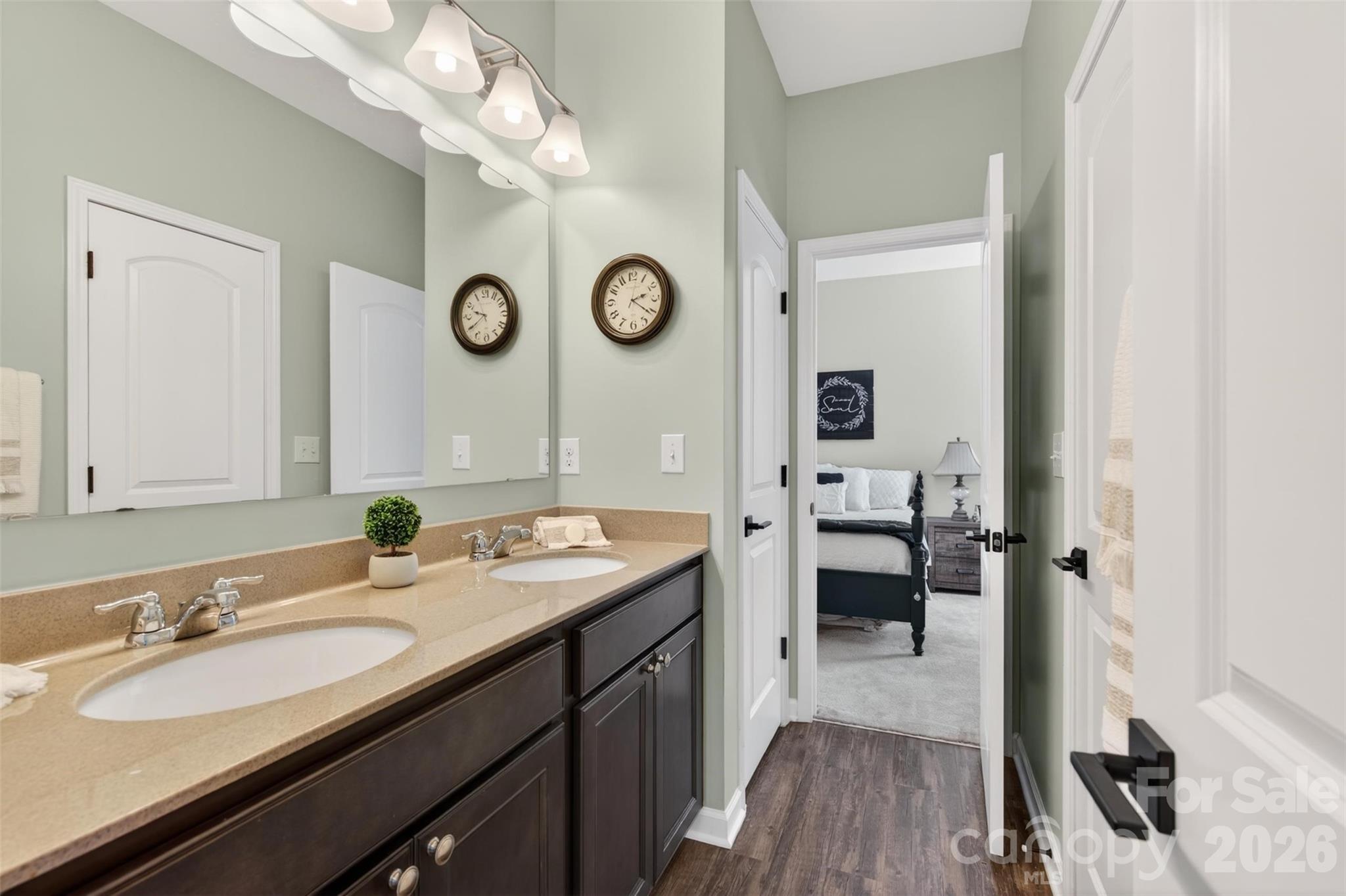 6038 Durango Way Denver, NC 28037 - Photo 15 of 20 a en suite bathroom with a double vanity sink and a mirror