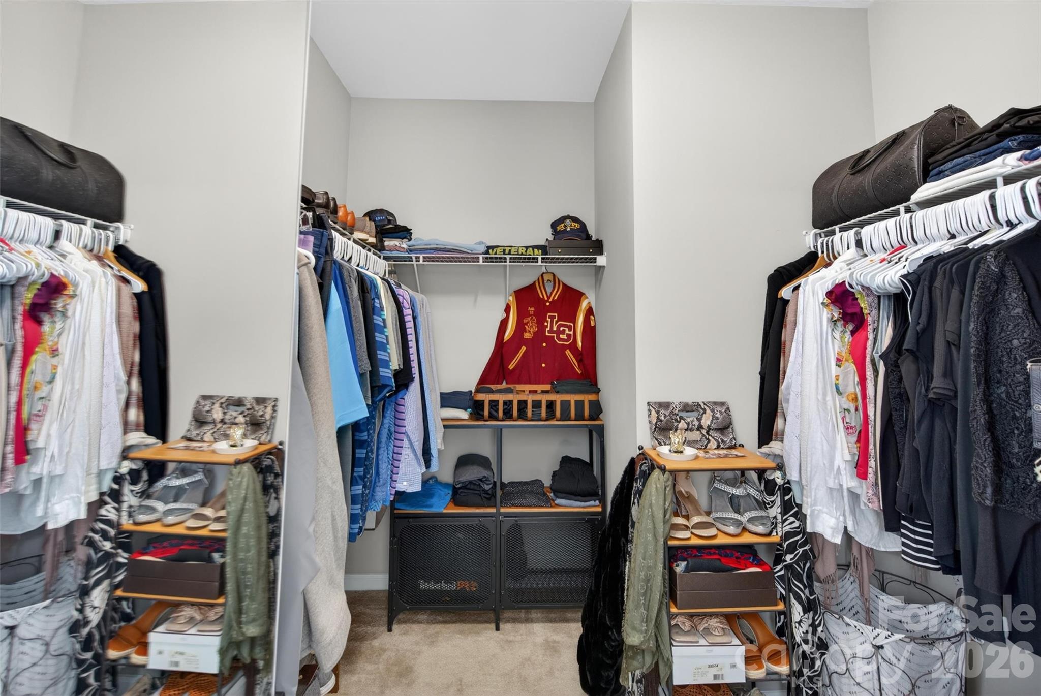 6038 Durango Way Denver, NC 28037 - Photo 18 of 20 a view of walk in closet with clothes and shoes