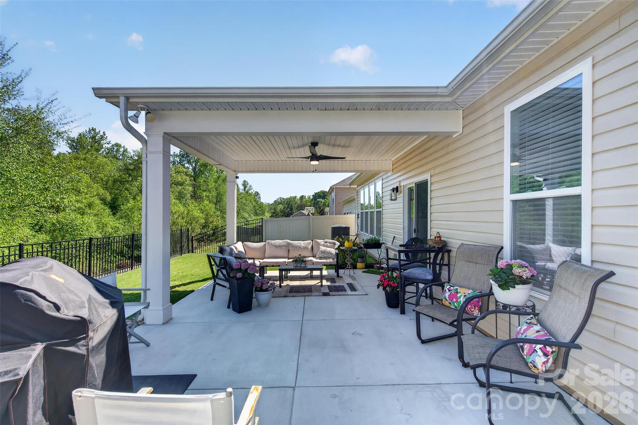 6038 Durango Way Denver, NC 28037 - Photo 20 of 20 a living room with patio furniture and garden view