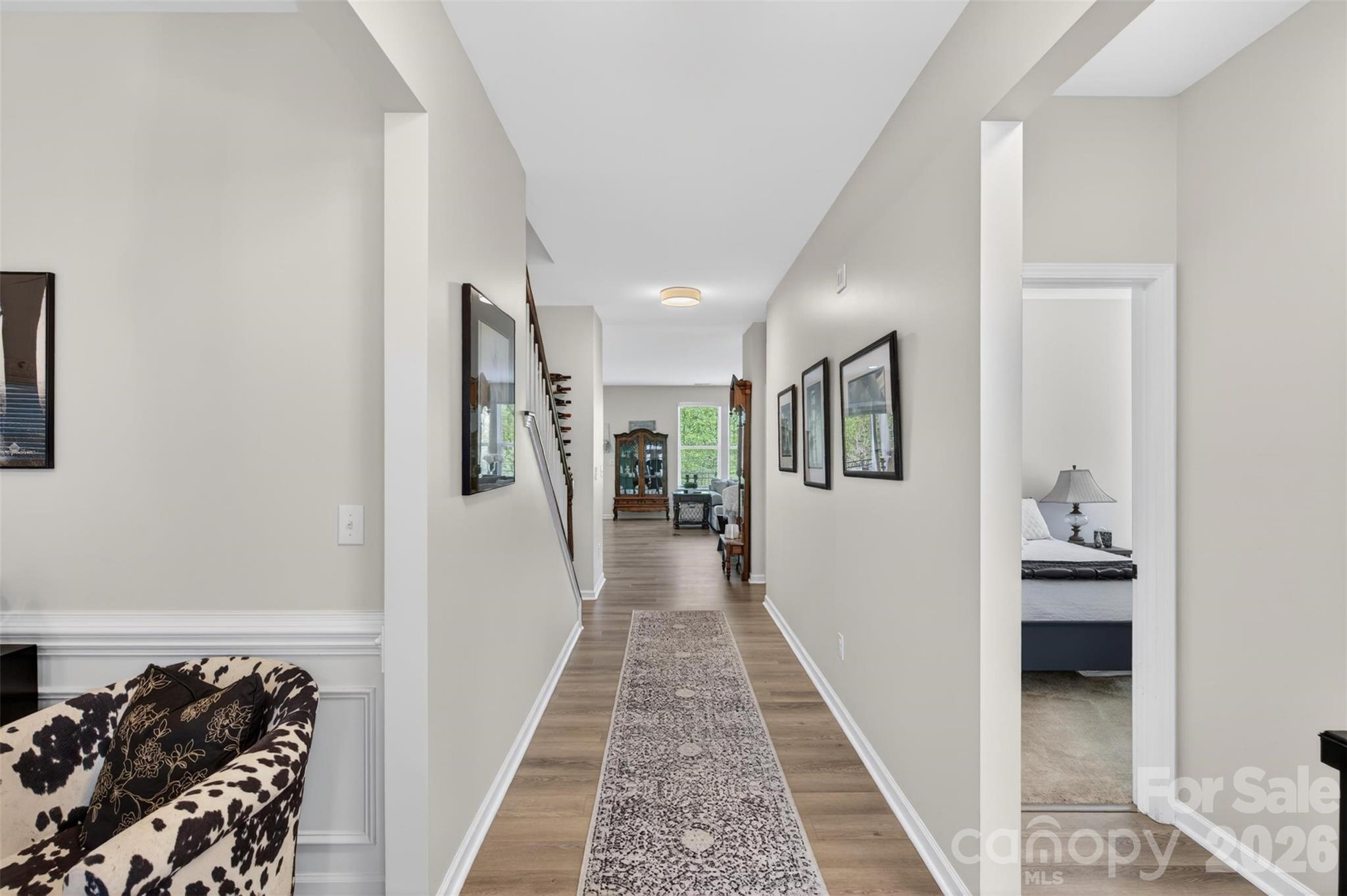 6038 Durango Way Denver, NC 28037 - Photo 3 of 20 a hallway with a furniture and wooden floor