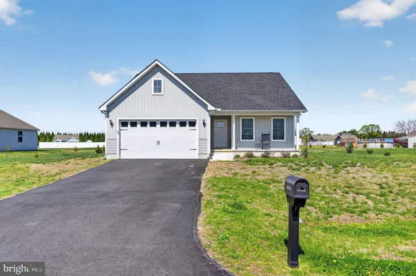 a view of house with yard