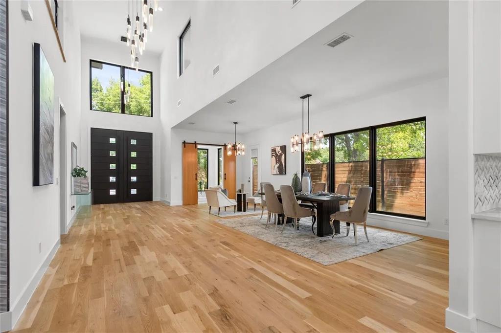 309 Kaye Street Coppell, TX 75019 - Photo 11 of 36 Grand entry featuring a double-height ceiling and light wood-finish flooring