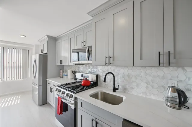 a view of hallway with wooden floor