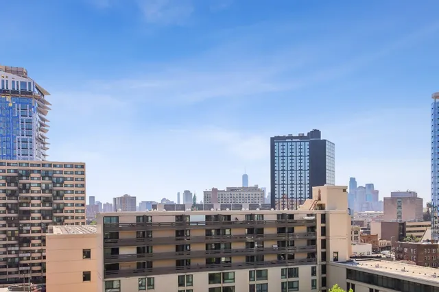 a view of a city with tall buildings