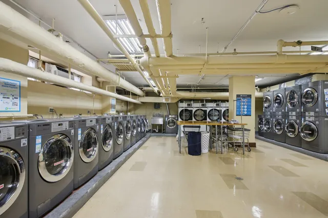 a large room with lots of counter space and windows