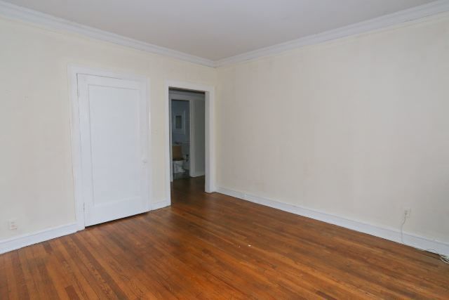 1921 West Winnemac Avenue, Unit 1 Chicago, IL 60640 - Photo 10 of 14 a view of an empty room with wooden floor and closet