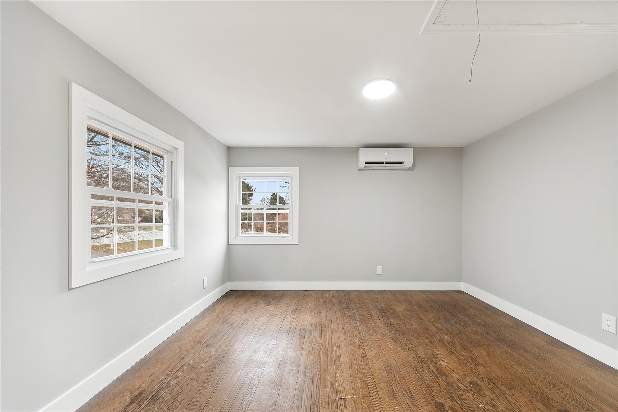 96 Fairmont Road Mahopac, NY 10541 - Photo 15 of 29 an empty room with wooden floor and windows