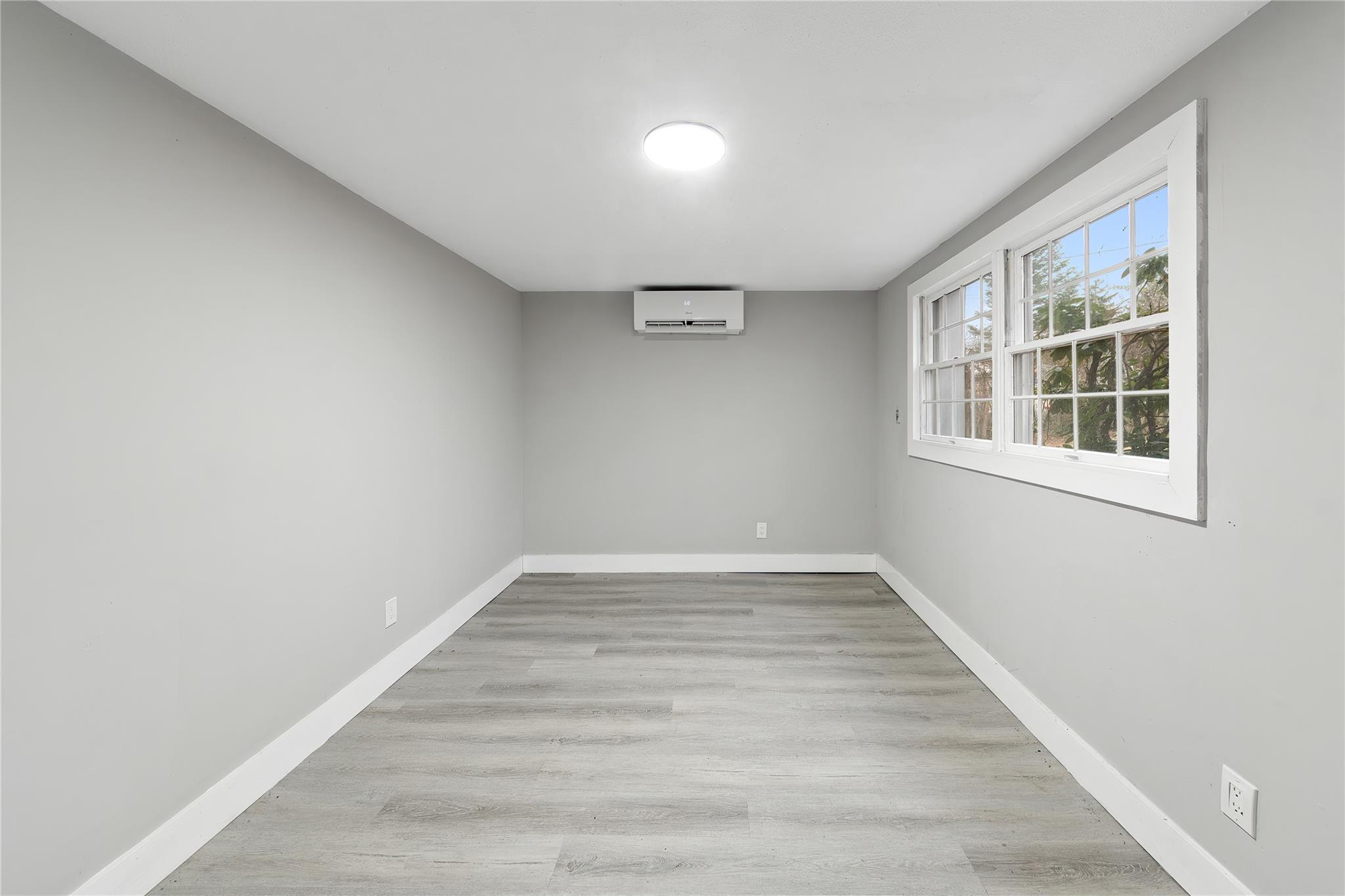 96 Fairmont Road Mahopac, NY 10541 - Photo 19 of 29 an empty room with wooden floor and windows