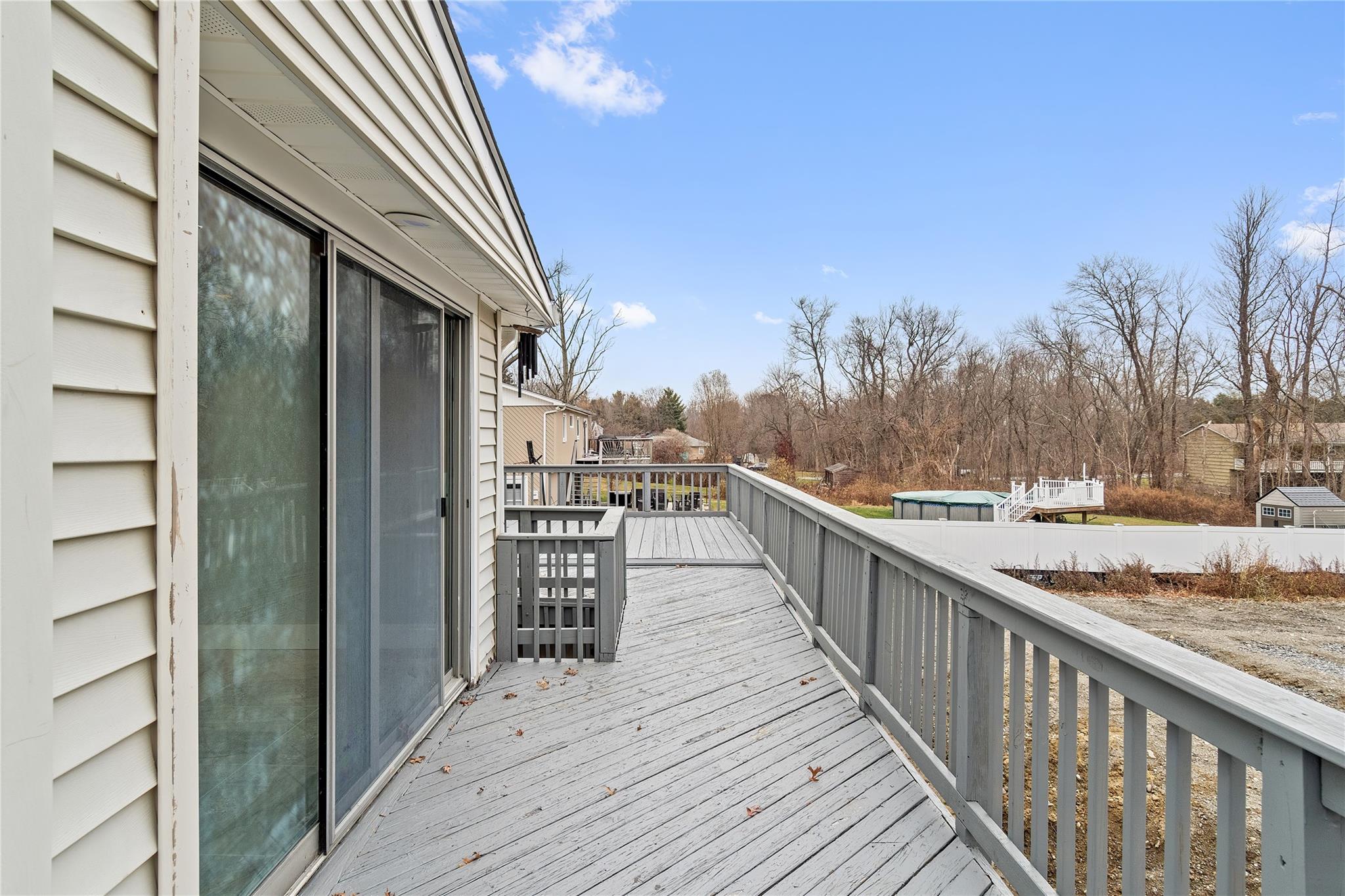 96 Fairmont Road Mahopac, NY 10541 - Photo 24 of 29 a view of a balcony with wooden floor and wooden fence