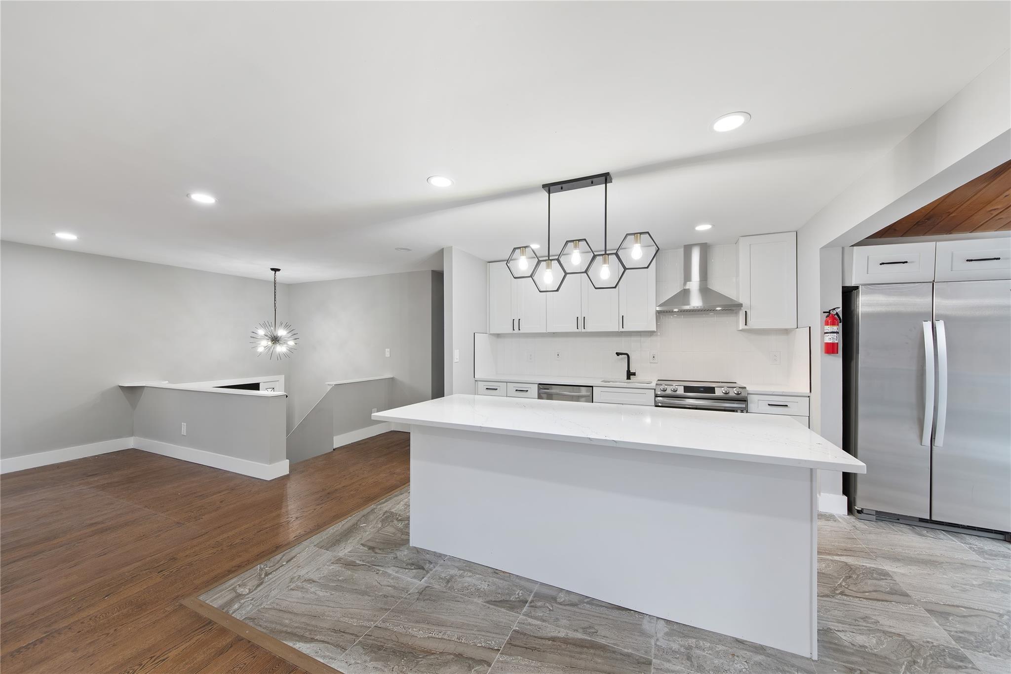 96 Fairmont Road Mahopac, NY 10541 - Photo 7 of 29 a large kitchen with a refrigerator a stove and white cabinets