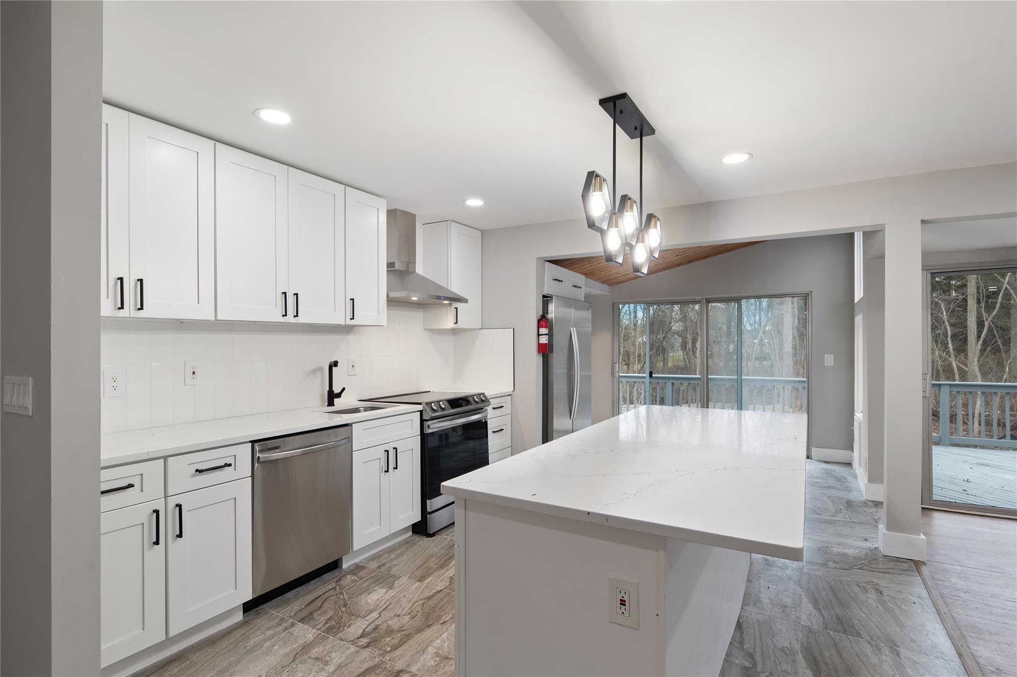 96 Fairmont Road Mahopac, NY 10541 - Photo 8 of 29 a kitchen with kitchen island a large counter space appliances and cabinets
