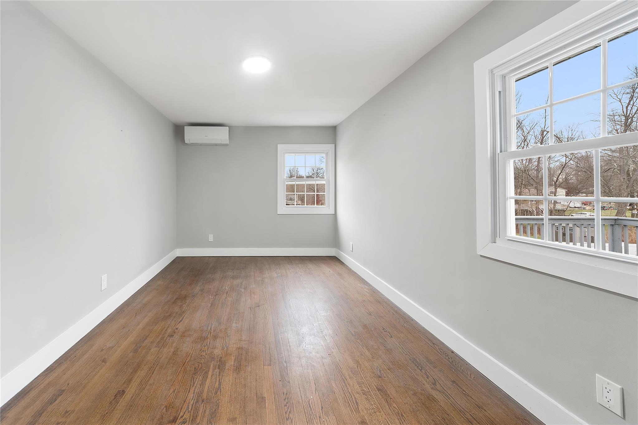 96 Fairmont Road Mahopac, NY 10541 - Photo 10 of 29 an empty room with wooden floor and windows
