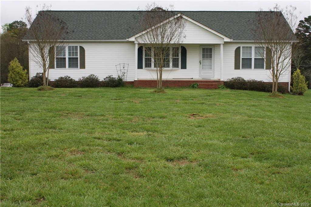 1095 Lawrence Road Clover, SC 29710 - Photo 1 of 20 a front view of a house with garden
