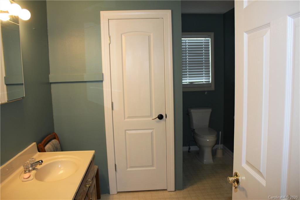 1095 Lawrence Road Clover, SC 29710 - Photo 16 of 20 a bathroom with a sink and a mirror