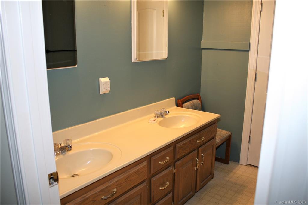 1095 Lawrence Road Clover, SC 29710 - Photo 17 of 20 a bathroom with a sink and a mirror