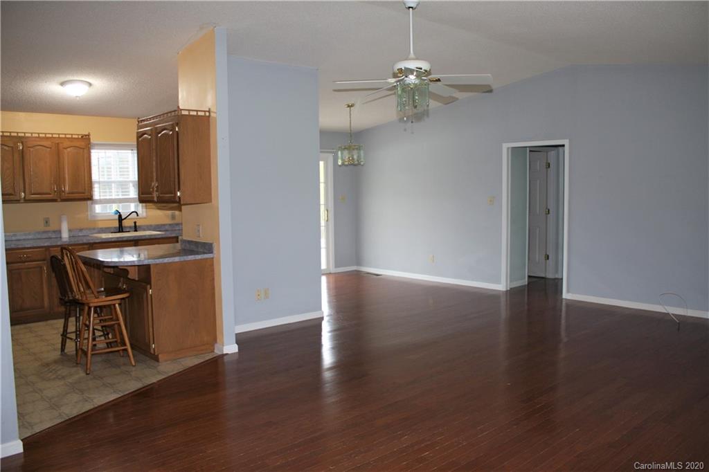 1095 Lawrence Road Clover, SC 29710 - Photo 3 of 20 a view of a dining room with furniture and wooden floor
