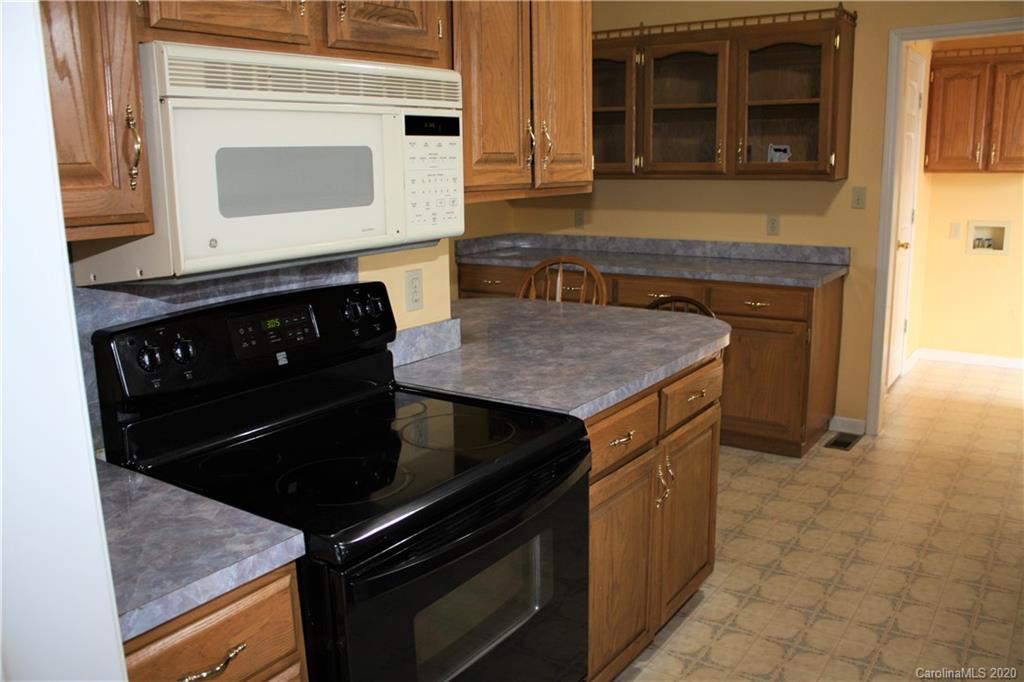 1095 Lawrence Road Clover, SC 29710 - Photo 9 of 20 a kitchen with a stove and a microwave