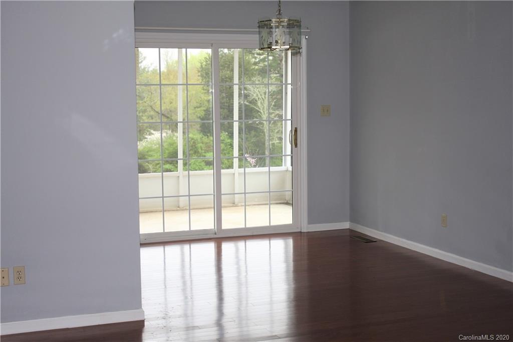 1095 Lawrence Road Clover, SC 29710 - Photo 10 of 20 a view of an empty room with wooden floor and a window