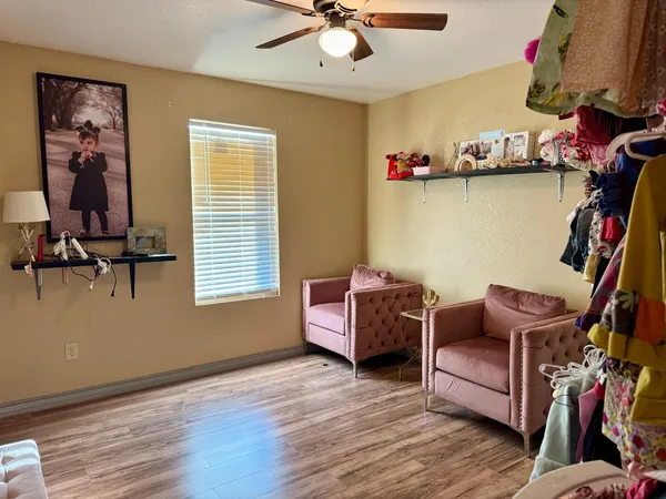 a room with furniture and a wooden floor