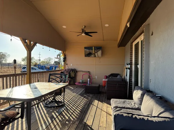 a balcony view with a seating space