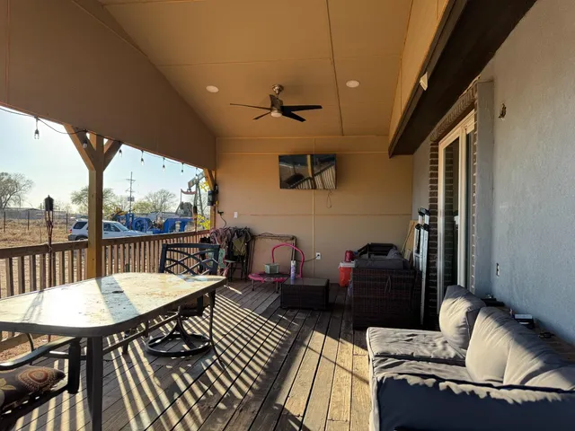 a balcony view with a seating space