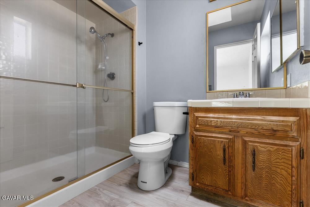 114 Chaparrel Street Tehachapi, CA 93561 - Photo 22 of 31 a bathroom with a sink toilet and shower