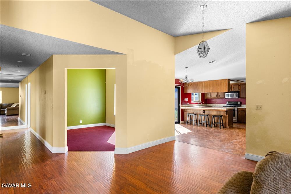 114 Chaparrel Street Tehachapi, CA 93561 - Photo 7 of 31 a living room with furniture and a wooden floor