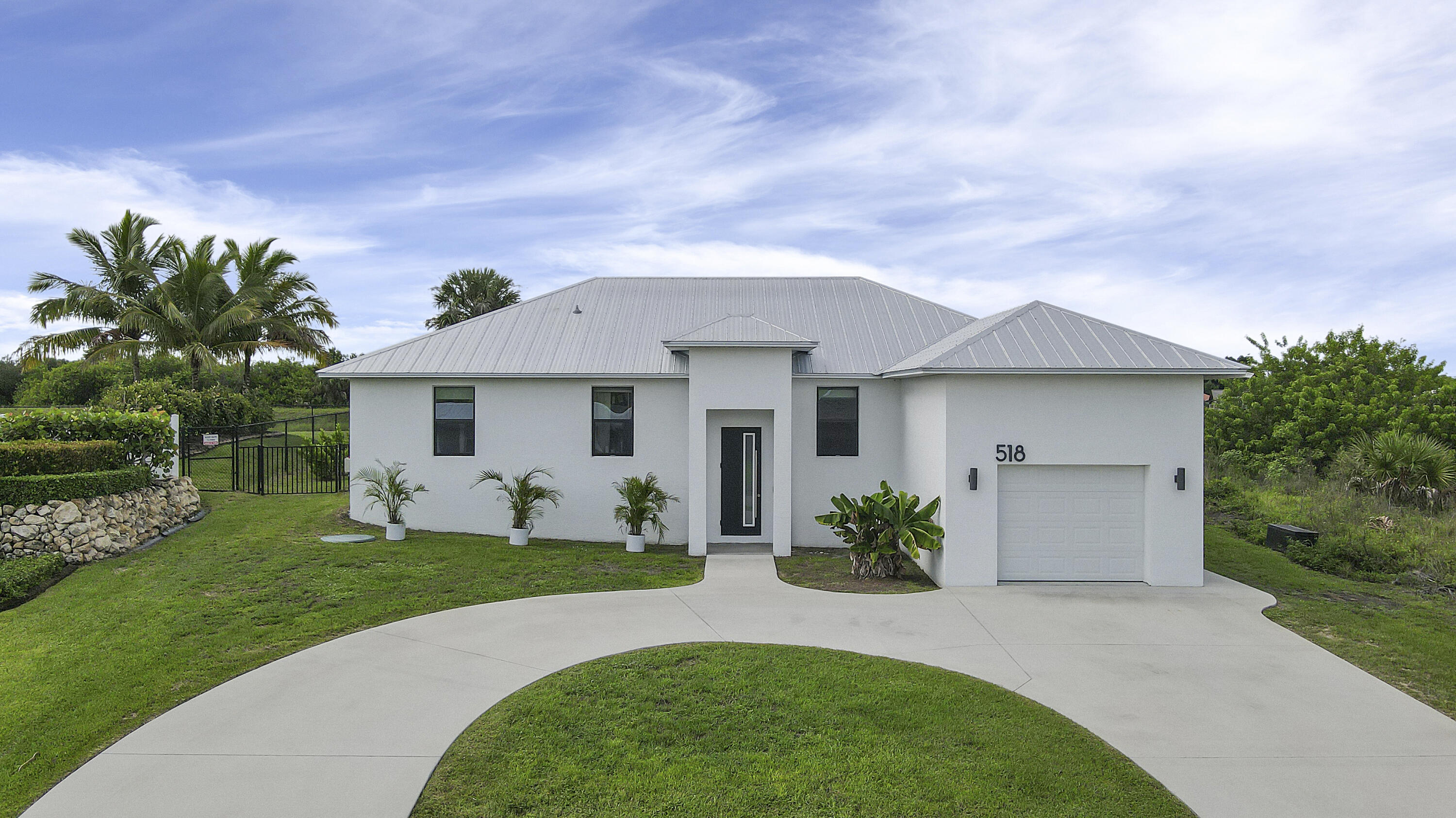518 Southwest Aster Road Port St. Lucie, FL 34953 - Photo 1 of 54 Main Entrance