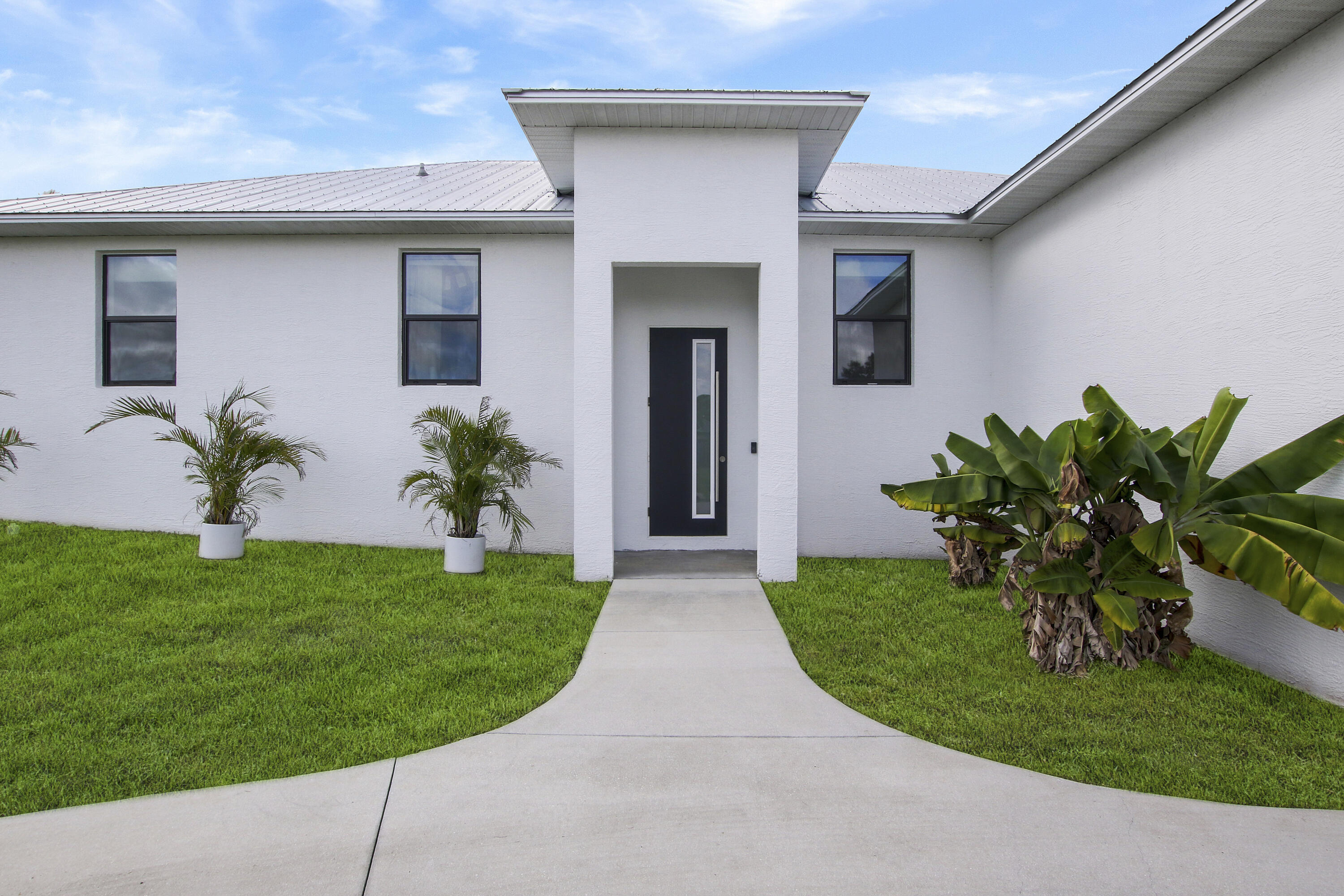 518 Southwest Aster Road Port St. Lucie, FL 34953 - Photo 4 of 54 Door