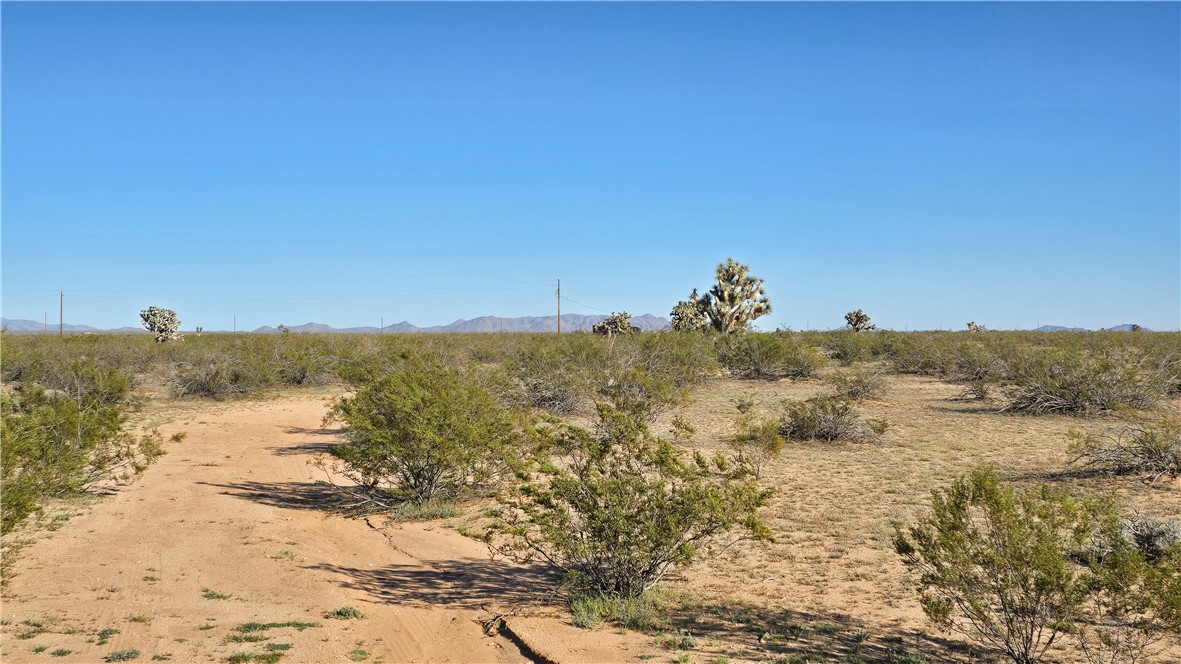 21688 South Roy Rogers Road Yucca, AZ 86438 - Photo 11 of 36 a view of a lake with a mountain in the background