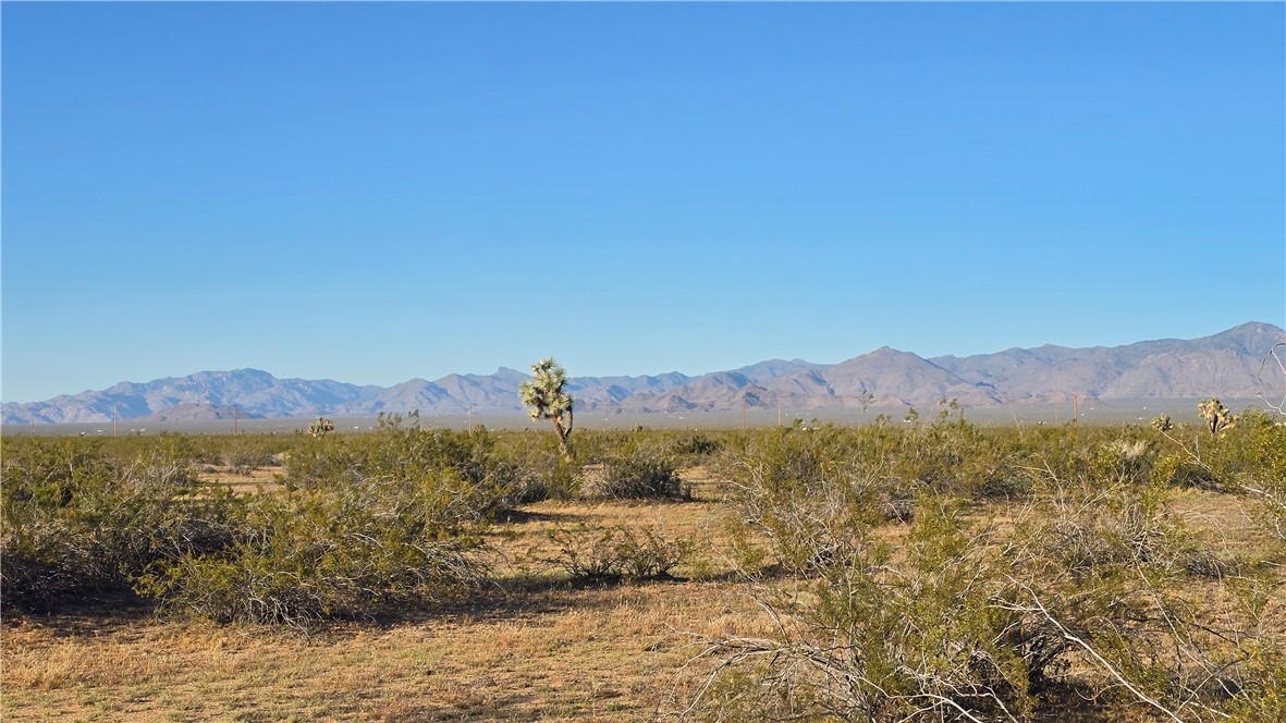 21688 South Roy Rogers Road Yucca, AZ 86438 - Photo 29 of 36 a view of mountain with sunset in background