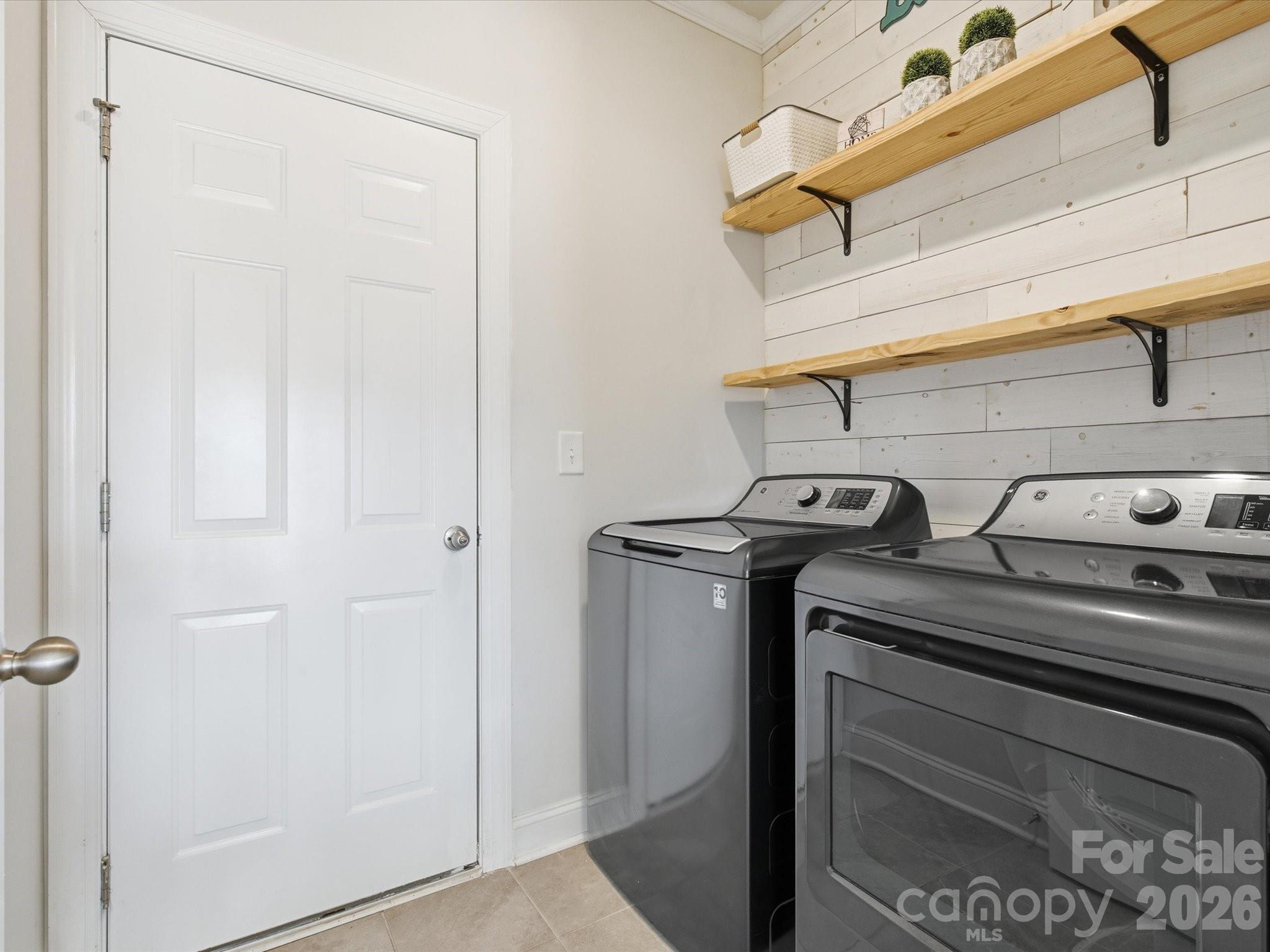 4435 Allenby Place Monroe, NC 28110 - Photo 13 of 32 a view of a storage and utility room with washer and dryer