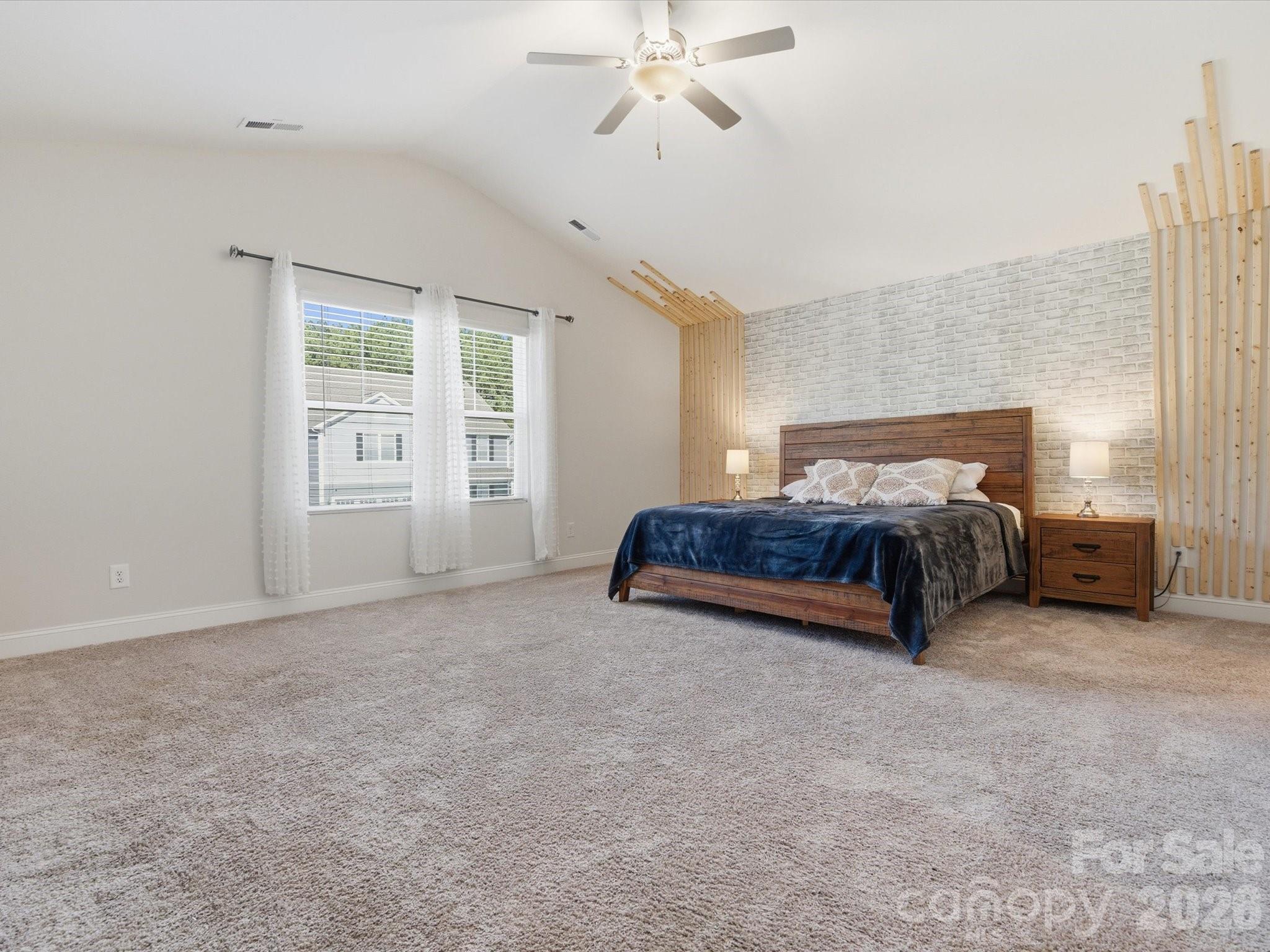 4435 Allenby Place Monroe, NC 28110 - Photo 15 of 32 a spacious bedroom with a bed and ceiling fan