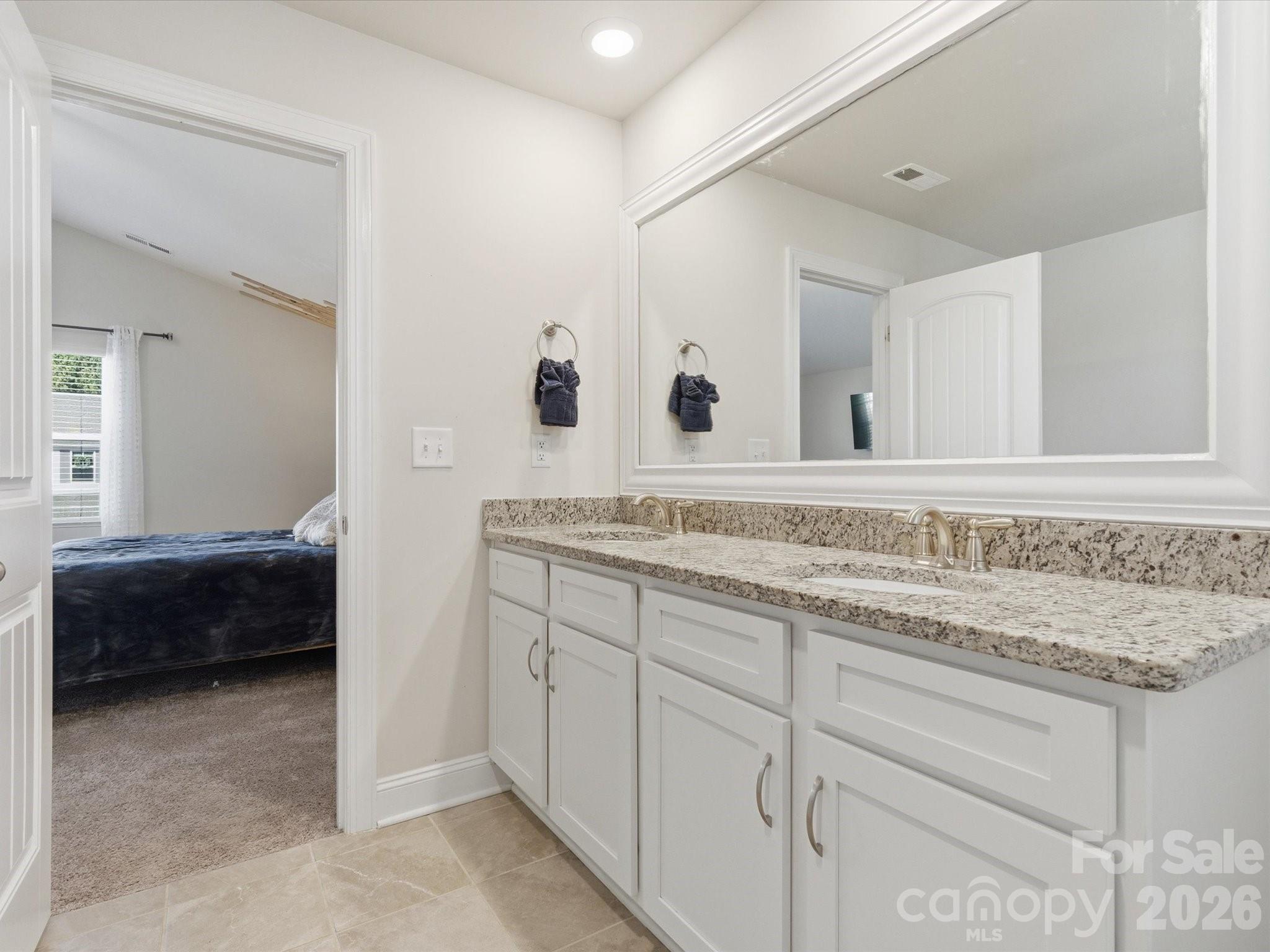4435 Allenby Place Monroe, NC 28110 - Photo 19 of 32 a bathroom with a sink and a mirror