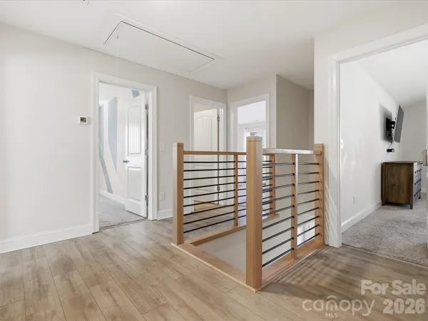 a view of a livingroom with furniture and staircase