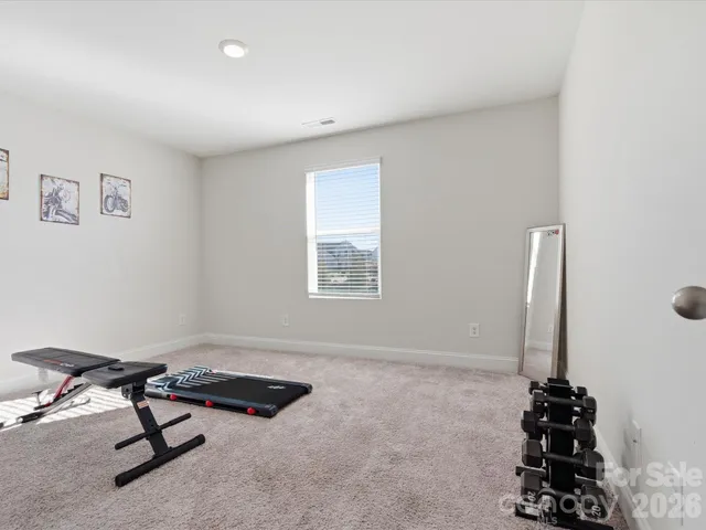a view of a room with a window and gym equipment