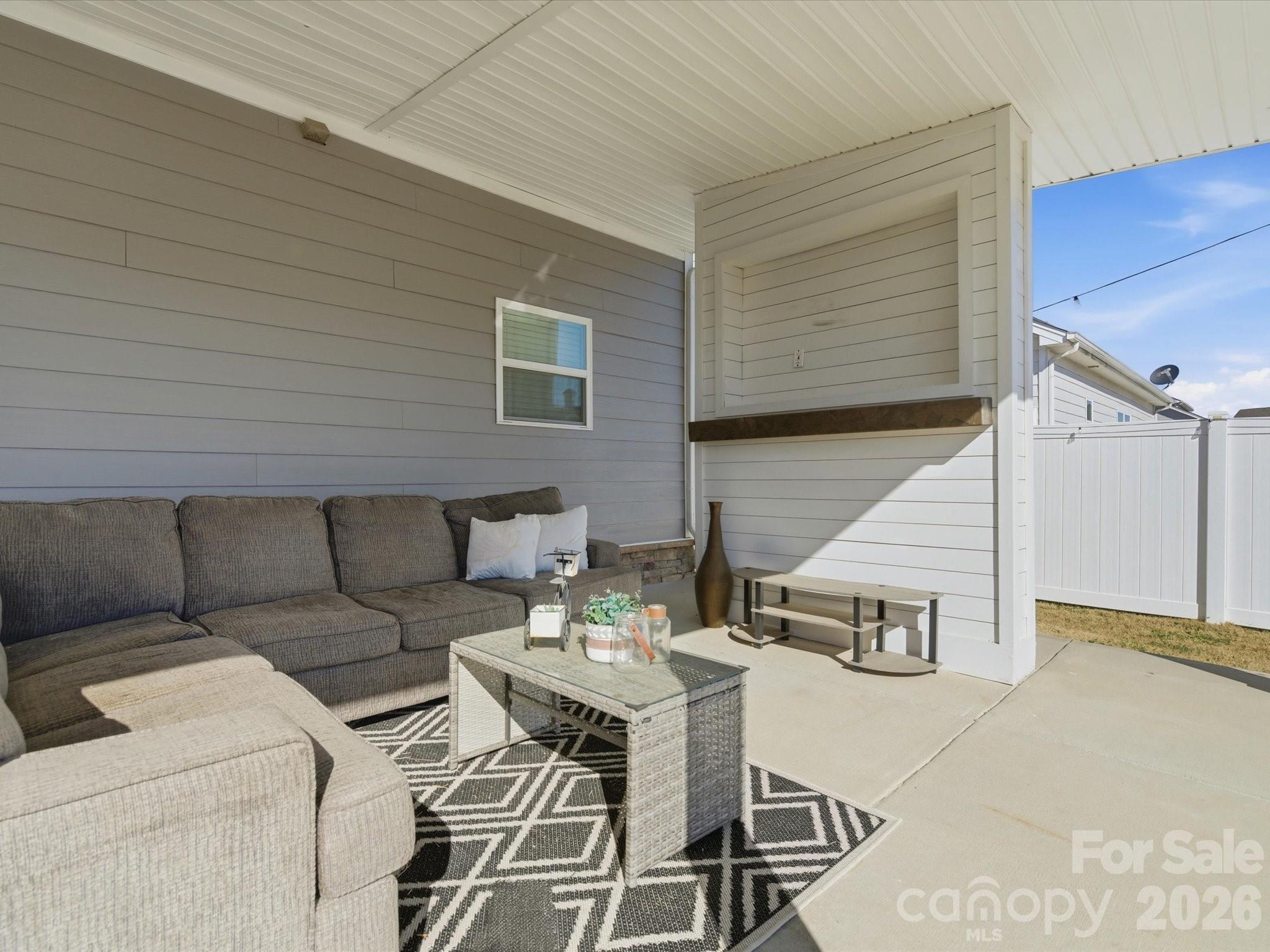 4435 Allenby Place Monroe, NC 28110 - Photo 26 of 32 a balcony with furniture and a potted plant