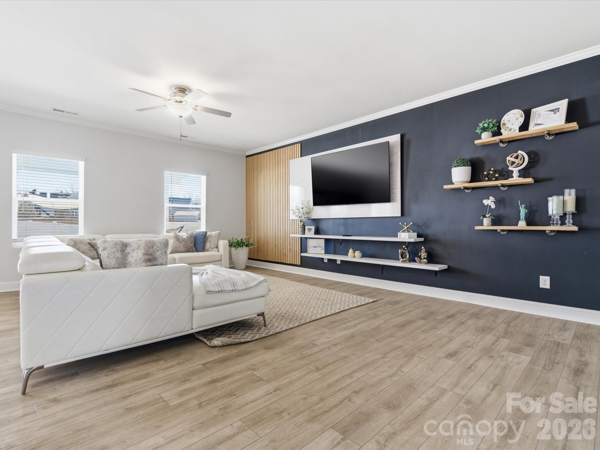 4435 Allenby Place Monroe, NC 28110 - Photo 5 of 32 a living room with furniture and a flat screen tv