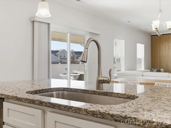 a kitchen with sink and window
