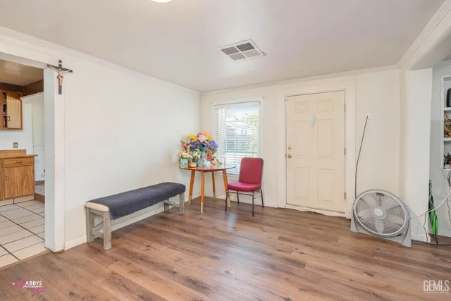 a dining room with furniture and wooden floor
