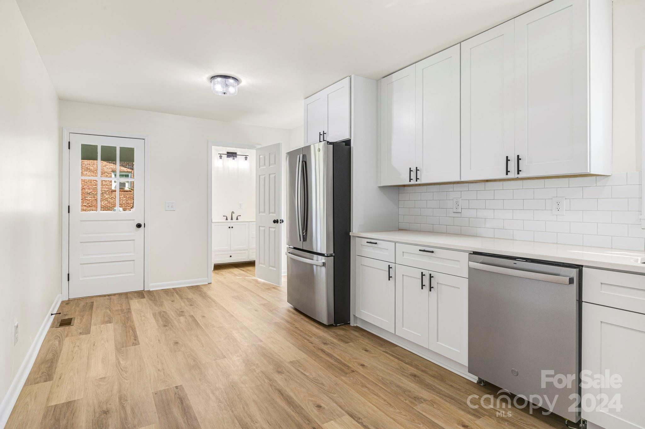 815 Poors Ford Road Rutherfordton, NC 28139 - Photo 13 of 30 a kitchen with a refrigerator sink and cabinets
