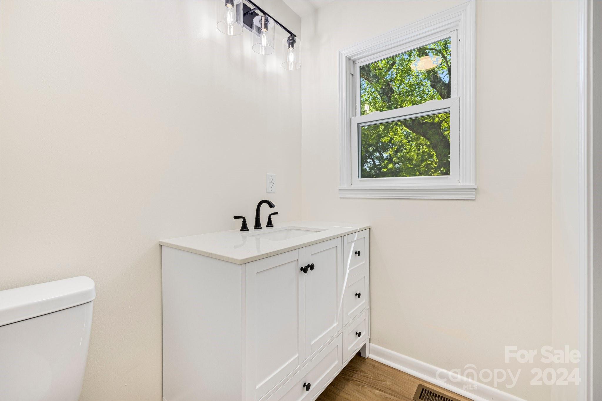 815 Poors Ford Road Rutherfordton, NC 28139 - Photo 17 of 30 a view of a bathroom with a sink and a window