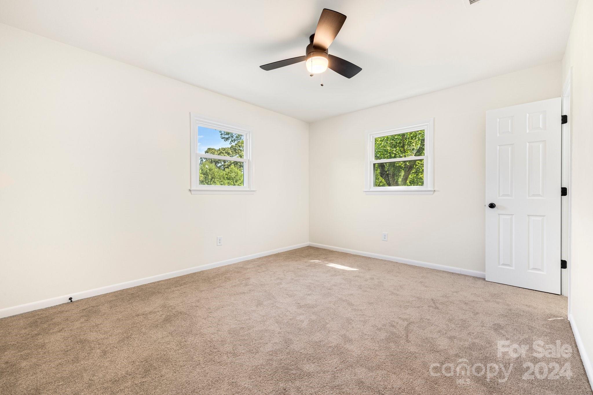 815 Poors Ford Road Rutherfordton, NC 28139 - Photo 23 of 30 an empty room with ceiling fan and window