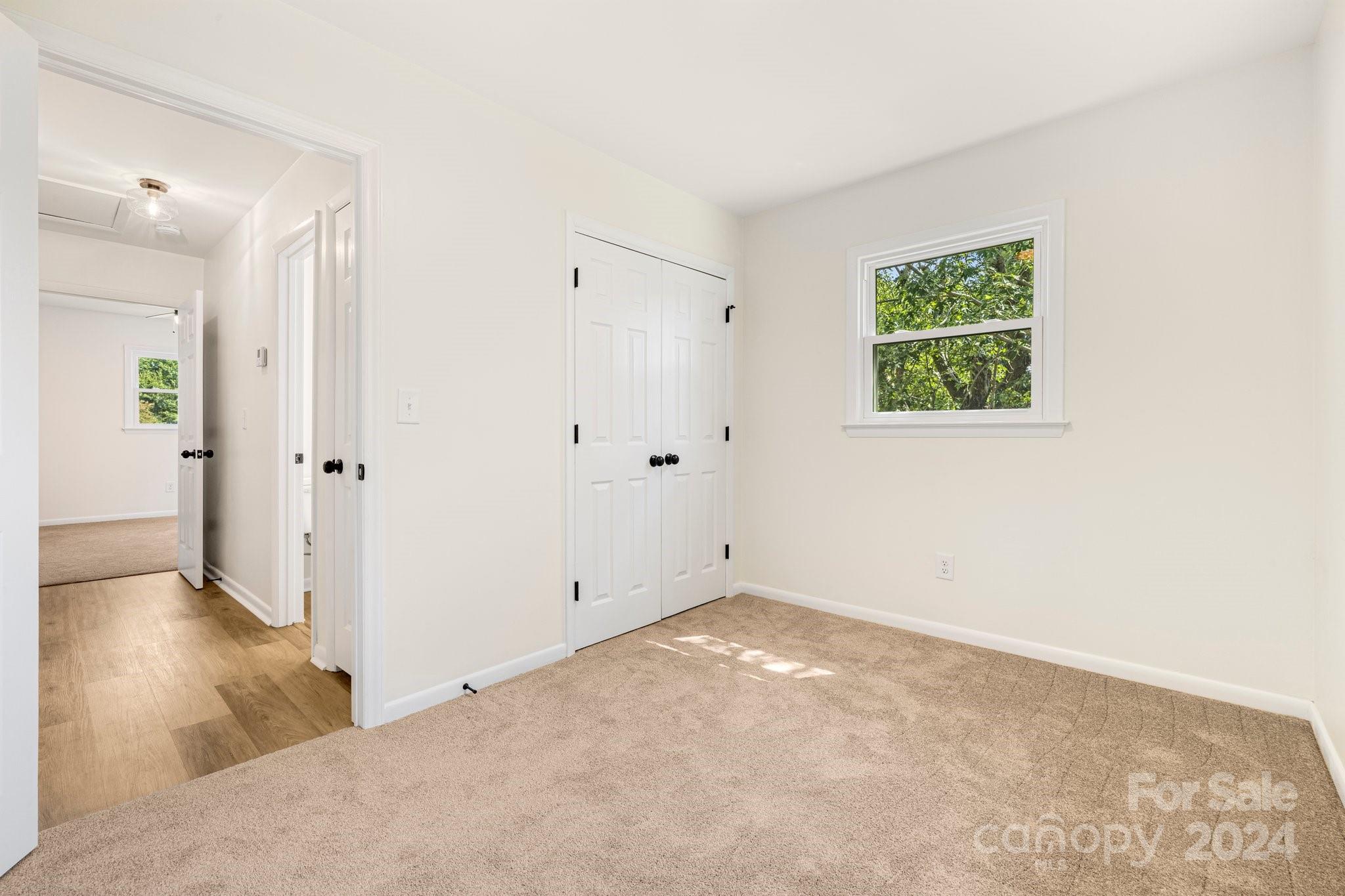 815 Poors Ford Road Rutherfordton, NC 28139 - Photo 25 of 30 an empty room with wooden floor and windows