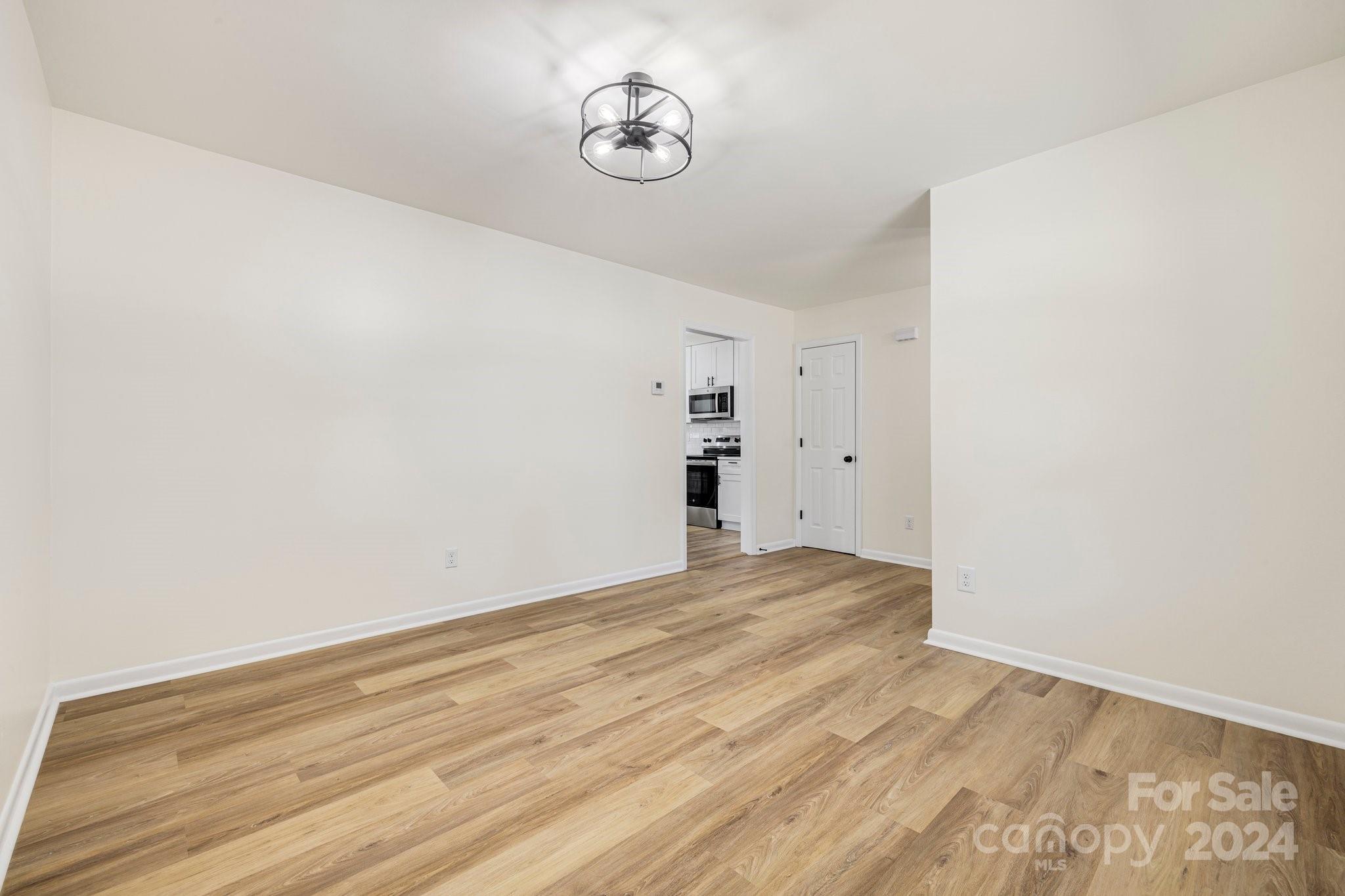 815 Poors Ford Road Rutherfordton, NC 28139 - Photo 8 of 30 a view of empty room with wooden floor