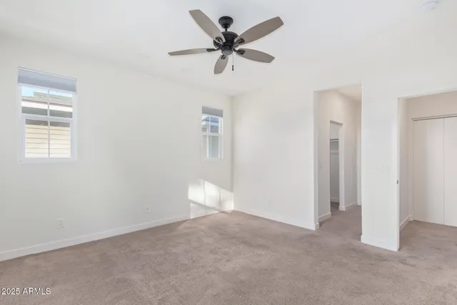 an empty room with window and windows