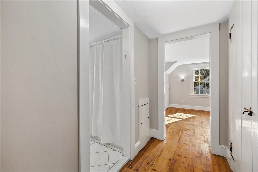 85 Franklin Road Longmeadow, MA 01106 - Photo 25 of 32 a view of a hallway with wooden floor and a bathroom