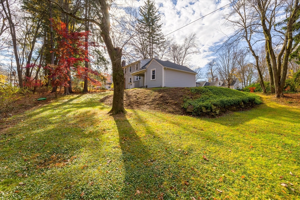85 Franklin Road Longmeadow, MA 01106 - Photo 4 of 32 a view of a house with a yard covered with large trees