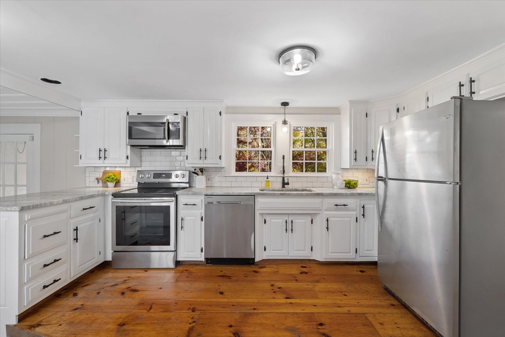 85 Franklin Road Longmeadow, MA 01106 - Photo 9 of 32 a kitchen with granite countertop white cabinets and white appliances